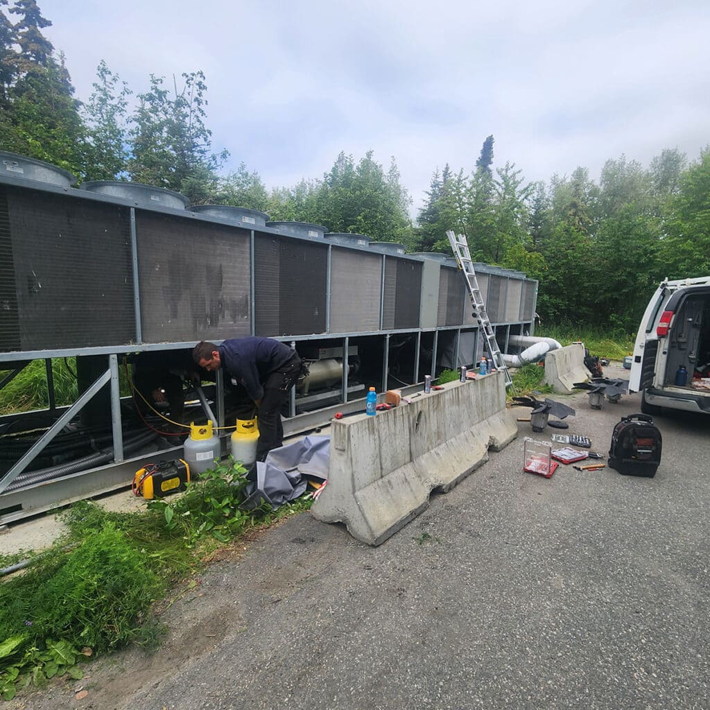 Man working on ventilation system